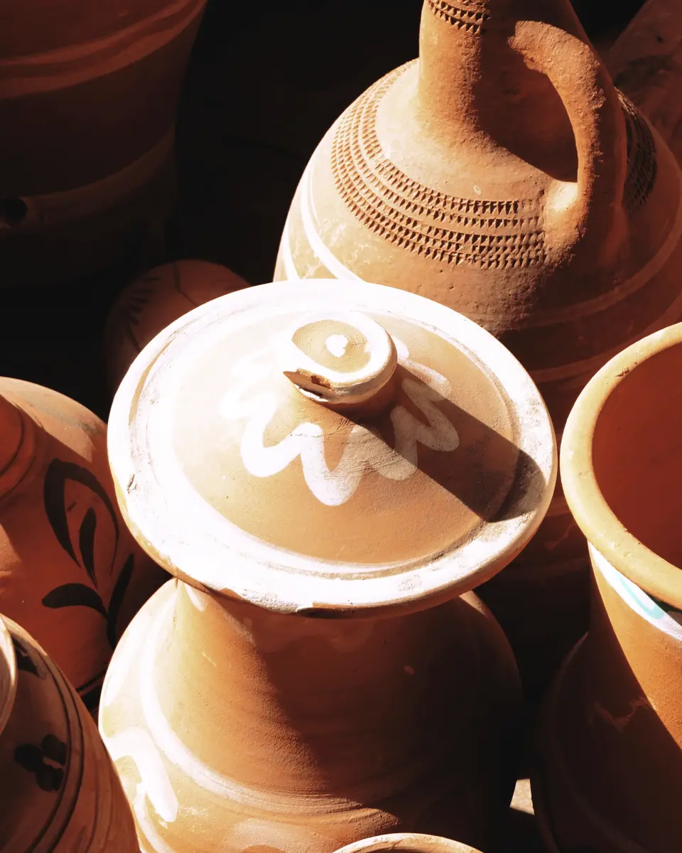 Terracotta jars in low, raking light